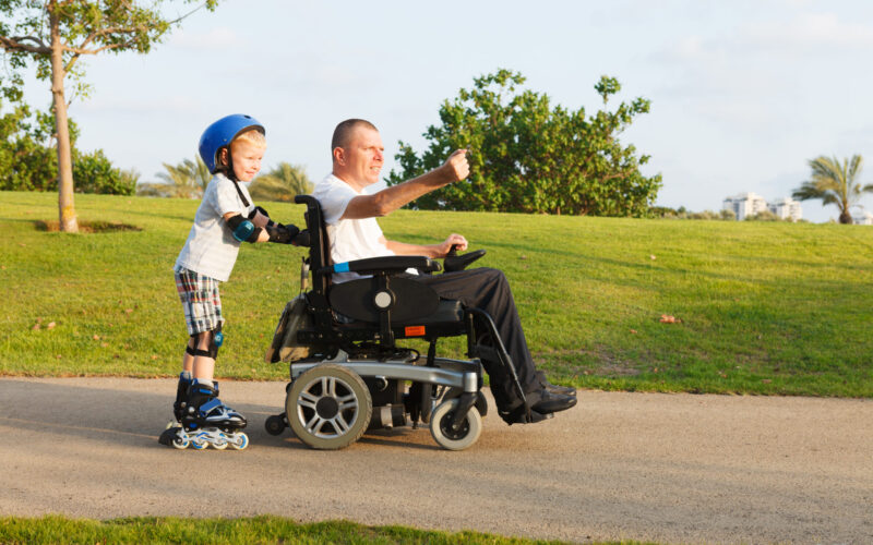 Disabled,Father,Rollerblading,With,Son